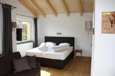 Ein Bett oder Betten in einem Zimmer der Unterkunft SonnenChalet Werfenweng