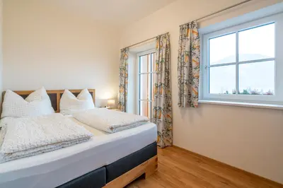 Ein Bett oder Betten in einem Zimmer der Unterkunft Fumerhof