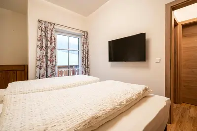 Ein Bett oder Betten in einem Zimmer der Unterkunft Fumerhof