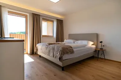 Ein Bett oder Betten in einem Zimmer der Unterkunft Waldrand Apartments