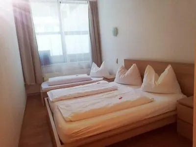 Ein Bett oder Betten in einem Zimmer der Unterkunft Econnomy Adler