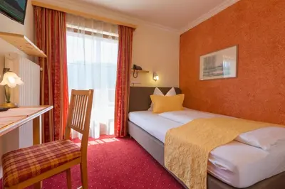 Ein Bett oder Betten in einem Zimmer der Unterkunft Hotel-Pension Das Platzl