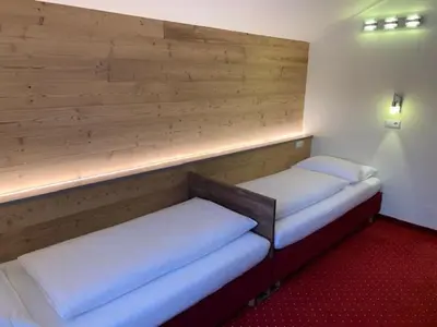 Ein Bett oder Betten in einem Zimmer der Unterkunft Hotel-Pension Das Platzl