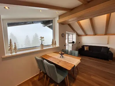 Ein Sitzbereich in der Unterkunft Appartements Zahnleiten