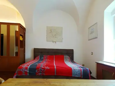 Ein Bett oder Betten in einem Zimmer der Unterkunft Gewölbezimmer am Marktplatz