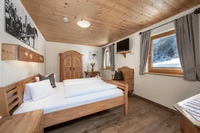 Ein Bett oder Betten in einem Zimmer der Unterkunft AUSTRIA APPART - natural Lifestyle Appartements auf der Piste
