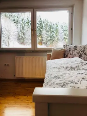 Ein Bett oder Betten in einem Zimmer der Unterkunft Family Apartment Alpine Living 2-4 Persons