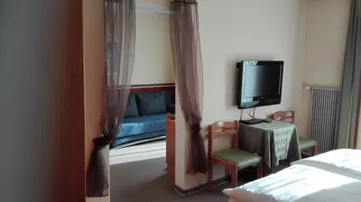Ein Bett oder Betten in einem Zimmer der Unterkunft Pension Restaurant Meran