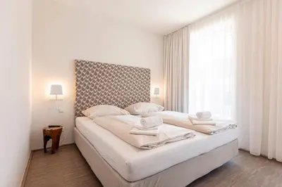 Ein Bett oder Betten in einem Zimmer der Unterkunft Alpenrock Schladming by ALPS RESORTS