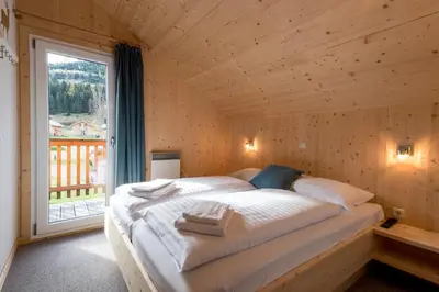 Ein Bett oder Betten in einem Zimmer der Unterkunft Hirsch Chalet