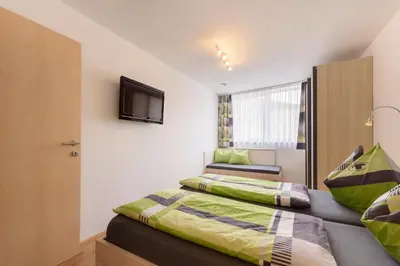 Ein Bett oder Betten in einem Zimmer der Unterkunft Ambiente
