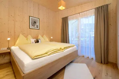 Ein Bett oder Betten in einem Zimmer der Unterkunft Appartement - Vollholz Studio im Zentrum von Flachau