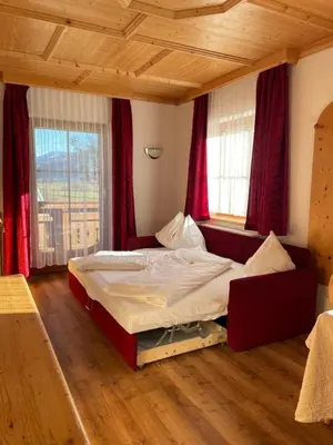 Ein Bett oder Betten in einem Zimmer der Unterkunft Moserhof