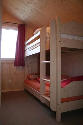 Ein Bett oder Betten in einem Zimmer der Unterkunft Alpenferienhaus Dachstein-West