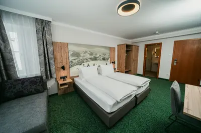 Ein Bett oder Betten in einem Zimmer der Unterkunft Apparthotel Samson