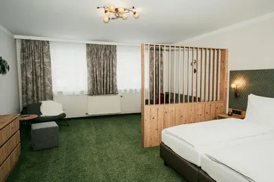 Ein Bett oder Betten in einem Zimmer der Unterkunft Apparthotel Samson