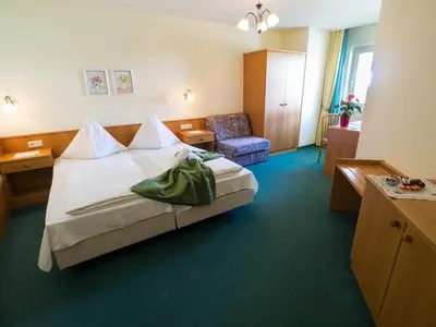 Ein Bett oder Betten in einem Zimmer der Unterkunft Aparthotel Alpina
