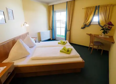Ein Bett oder Betten in einem Zimmer der Unterkunft Aparthotel Alpina