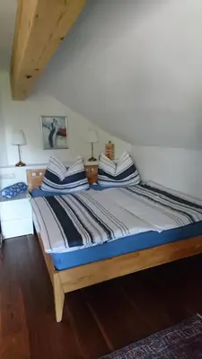 Ein Bett oder Betten in einem Zimmer der Unterkunft Haus in den Bergen