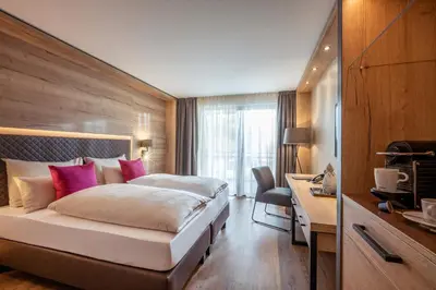 Ein Bett oder Betten in einem Zimmer der Unterkunft Hotel Adapura Wagrain