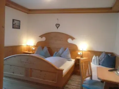 Ein Bett oder Betten in einem Zimmer der Unterkunft Biobauernhof Windbachgut