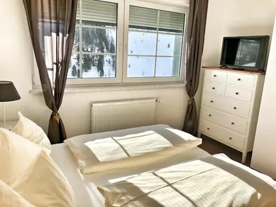 Ein Bett oder Betten in einem Zimmer der Unterkunft Hubertus Dependance