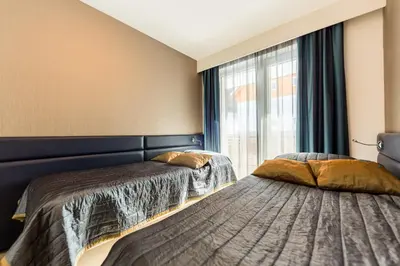 Ein Bett oder Betten in einem Zimmer der Unterkunft Sissi Park Haus im Ennstal - Schladming