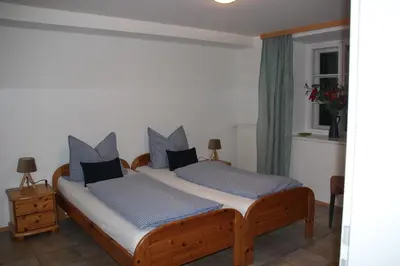 Ein Bett oder Betten in einem Zimmer der Unterkunft Haus Mauken - Appartments mit Panoramablick