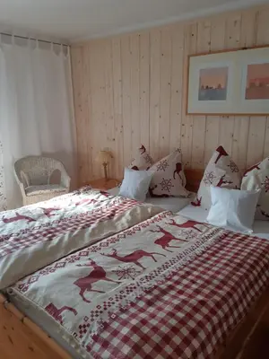 Ein Bett oder Betten in einem Zimmer der Unterkunft Haus Mauken - Appartments mit Panoramablick
