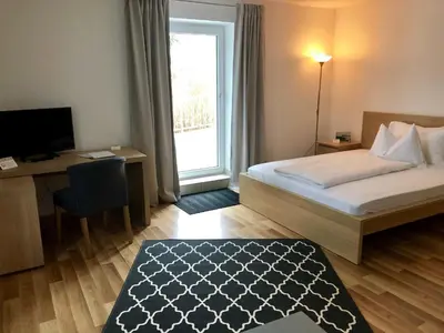 Ein Bett oder Betten in einem Zimmer der Unterkunft Forsthof Next Door