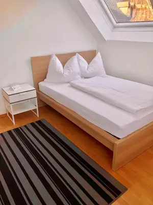 Ein Bett oder Betten in einem Zimmer der Unterkunft Forsthof Next Door