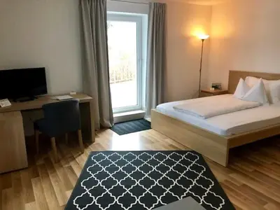 Ein Bett oder Betten in einem Zimmer der Unterkunft Forsthof Next Door