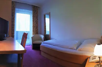 Ein Bett oder Betten in einem Zimmer der Unterkunft Hotel Post