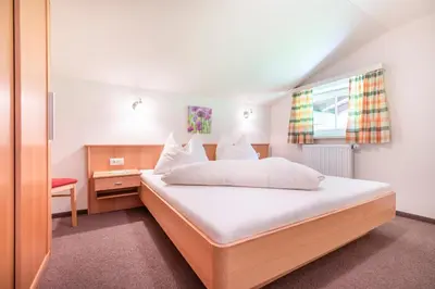 Ein Bett oder Betten in einem Zimmer der Unterkunft Wechslerhof
