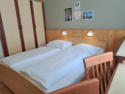 Ein Bett oder Betten in einem Zimmer der Unterkunft JUFA Hotel Bad Aussee