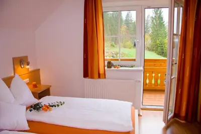 Ein Bett oder Betten in einem Zimmer der Unterkunft Ferienhof Rinnergut