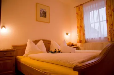 Ein Bett oder Betten in einem Zimmer der Unterkunft Ferienhof Rinnergut