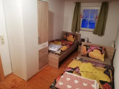 Ein Bett oder Betten in einem Zimmer der Unterkunft Ferienwohnung Andrea