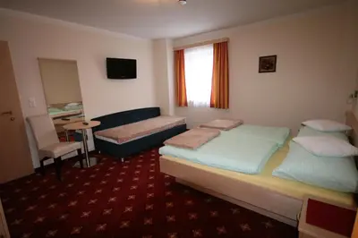 Ein Bett oder Betten in einem Zimmer der Unterkunft Pension Thorerhof