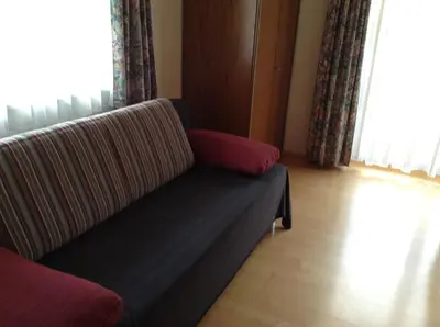 Ein Sitzbereich in der Unterkunft Haus Buchsteiner