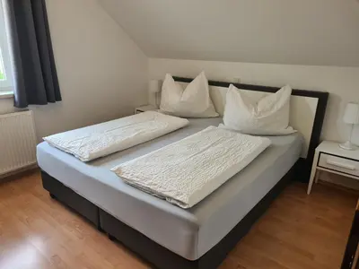 Ein Bett oder Betten in einem Zimmer der Unterkunft Ferienwohnung Schupfer - Free Parking, Seenähe & 5 Skigebieten