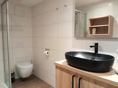 Ein Badezimmer in der Unterkunft Gasthof Steinbichler