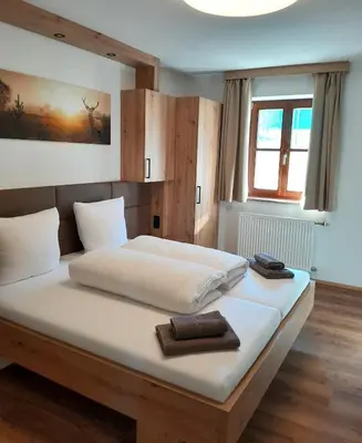 Ein Bett oder Betten in einem Zimmer der Unterkunft Gasthof Steinbichler