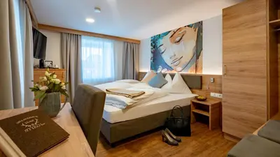 Ein Bett oder Betten in einem Zimmer der Unterkunft Hotel Stiegler Bed & Breakfast