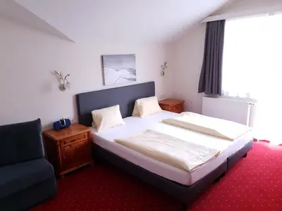 Ein Bett oder Betten in einem Zimmer der Unterkunft Aparthotel Pichler