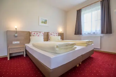 Ein Bett oder Betten in einem Zimmer der Unterkunft Aparthotel Pichler