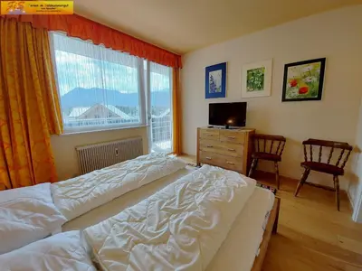 Ein Bett oder Betten in einem Zimmer der Unterkunft Apartment Grimmingnest by FiS - Fun in Styria