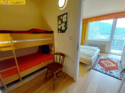 Ein Bett oder Betten in einem Zimmer der Unterkunft Apartment Grimmingnest by FiS - Fun in Styria