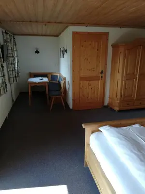 Ein Bett oder Betten in einem Zimmer der Unterkunft Wieselmühle Forellenhof