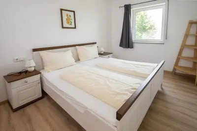 Ein Bett oder Betten in einem Zimmer der Unterkunft Familienferienhof Stabauer